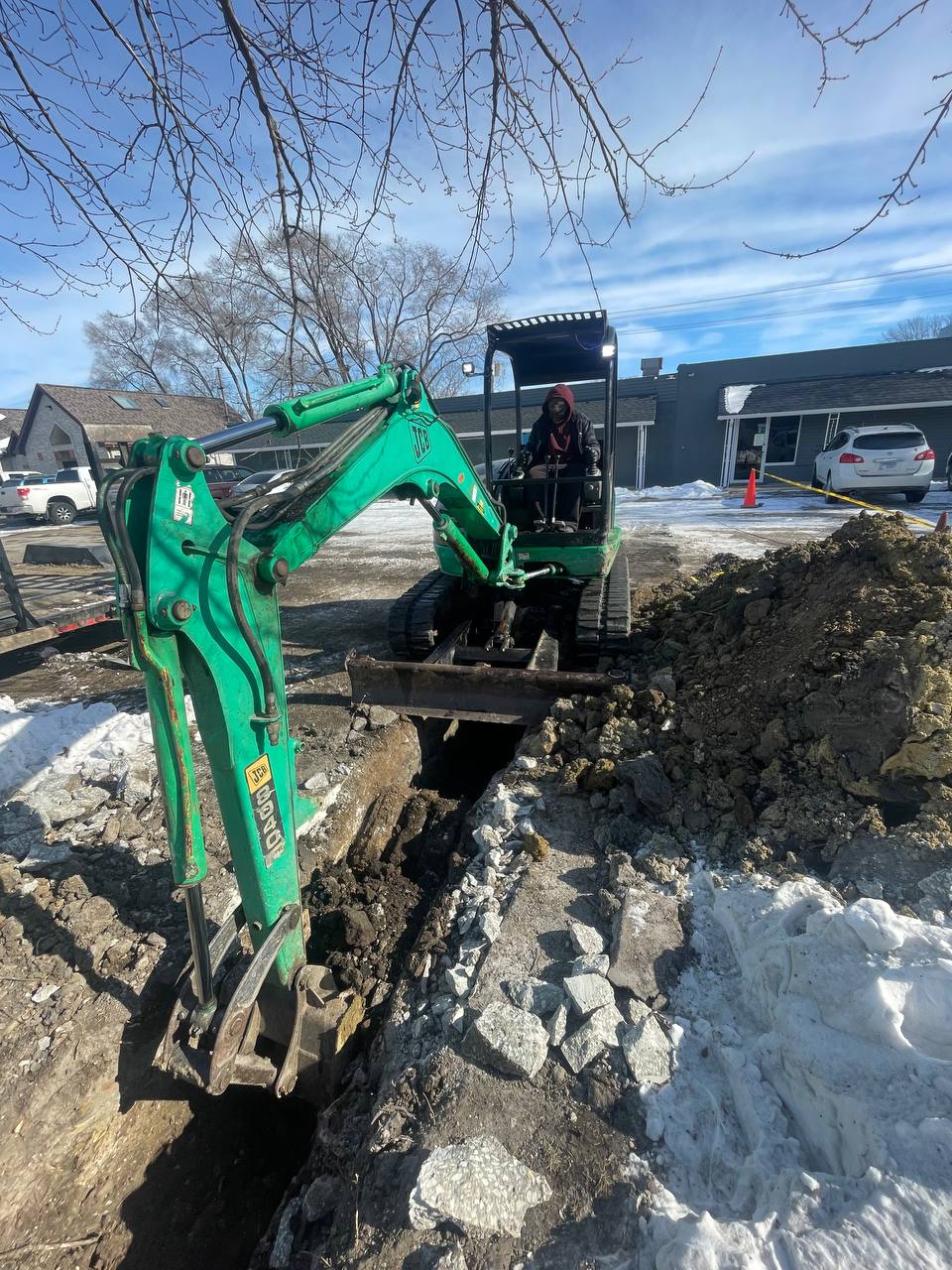Brohez Trucking excavator working winter job site in central Illinois