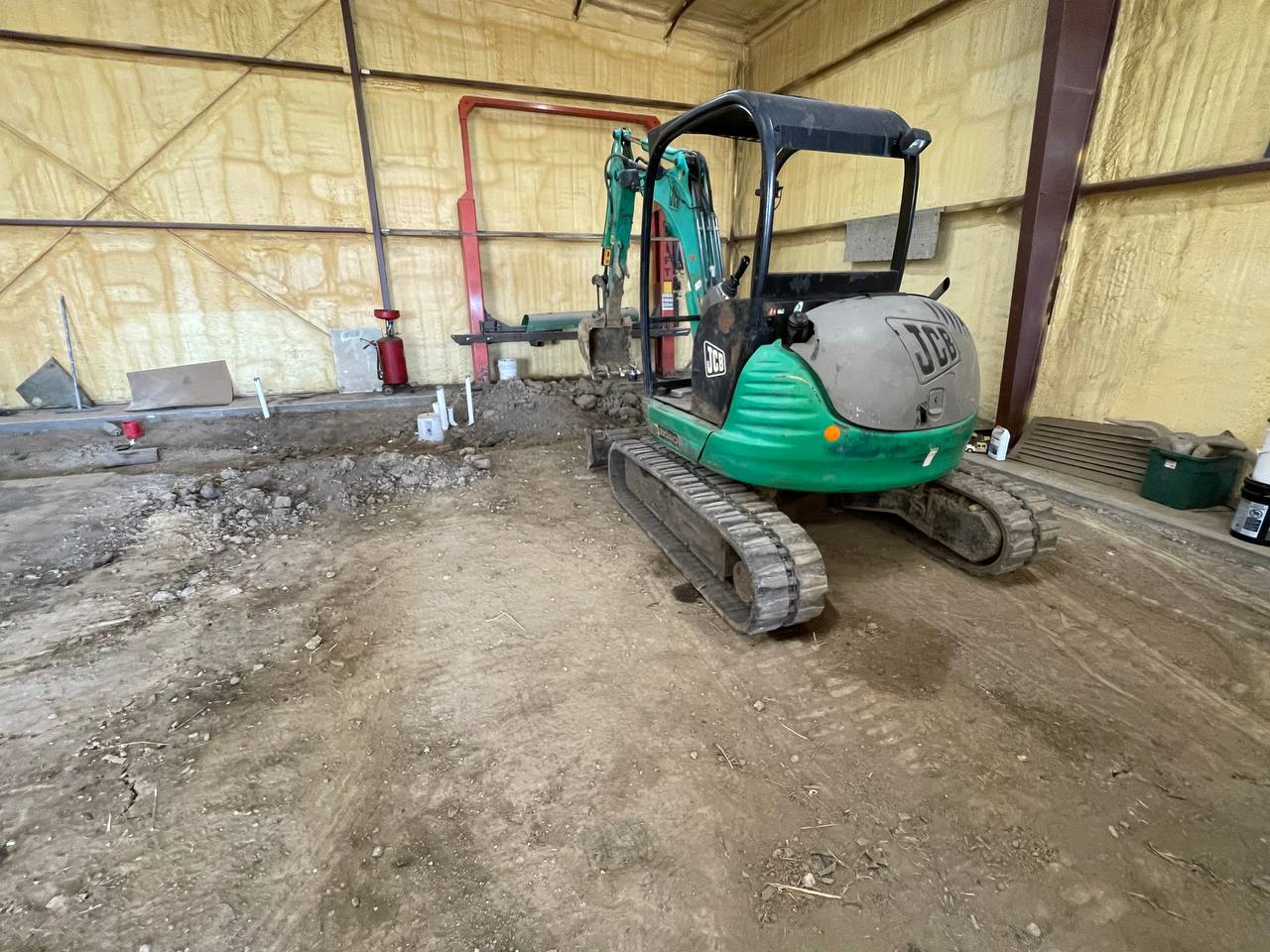JCB mini excavator at the shop ready for clearing — Brohez Trucking