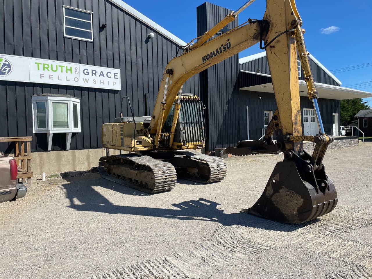 Komatsu excavator on a commercial building demolition job — Brohez Trucking LLC central Illinois