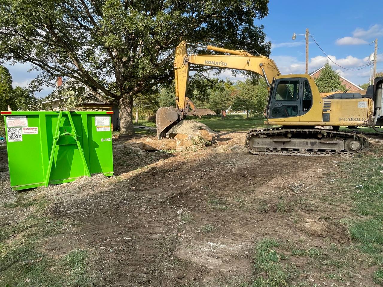 Komatsu PC150LC demolishing old concrete structure — Brohez Trucking