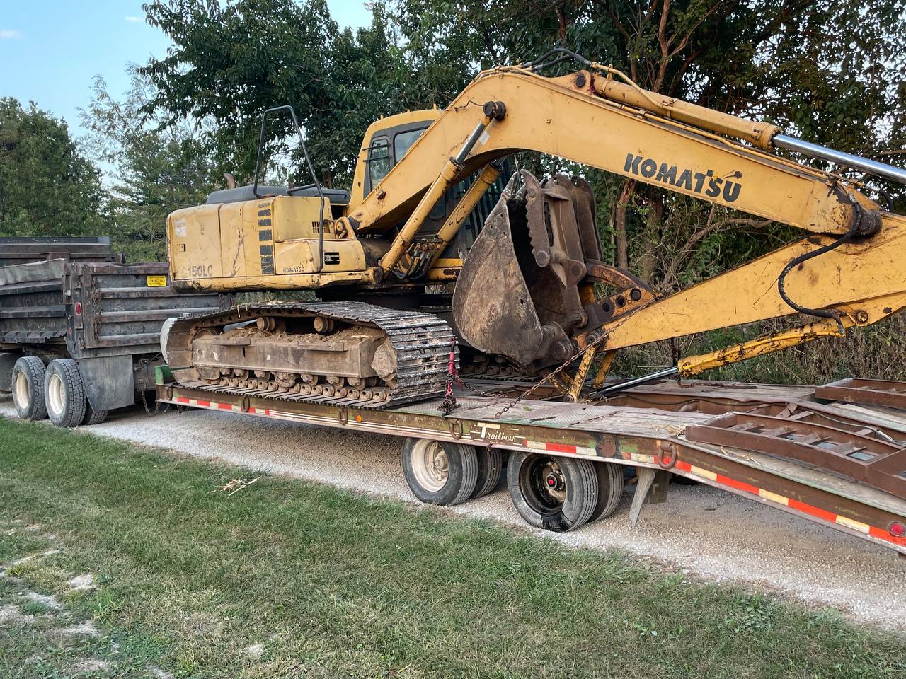 Komatsu excavator transported to pond dredging site — Brohez Trucking