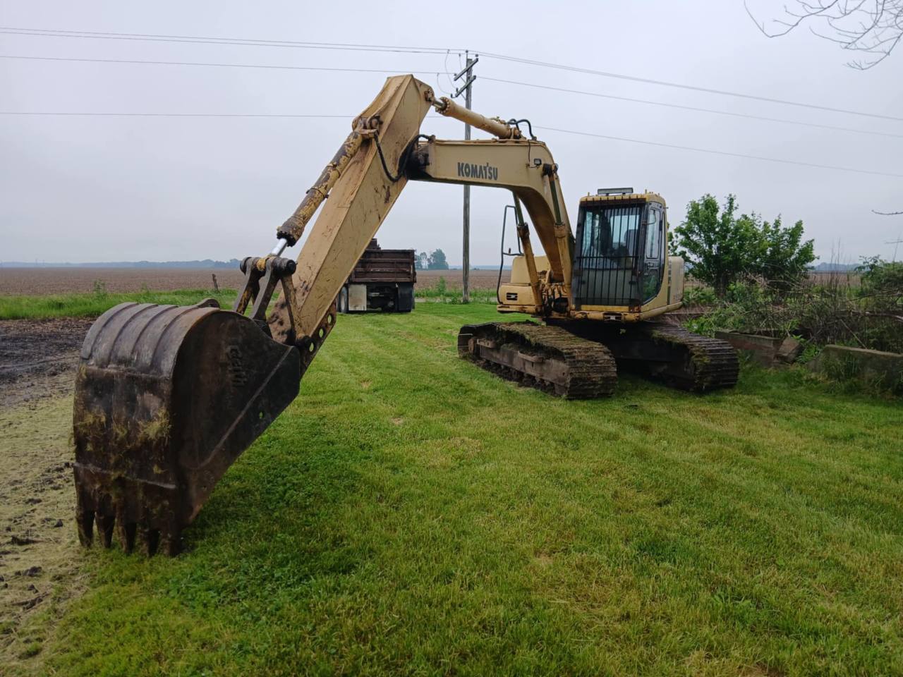 Komatsu excavator on demolition job — Brohez Trucking