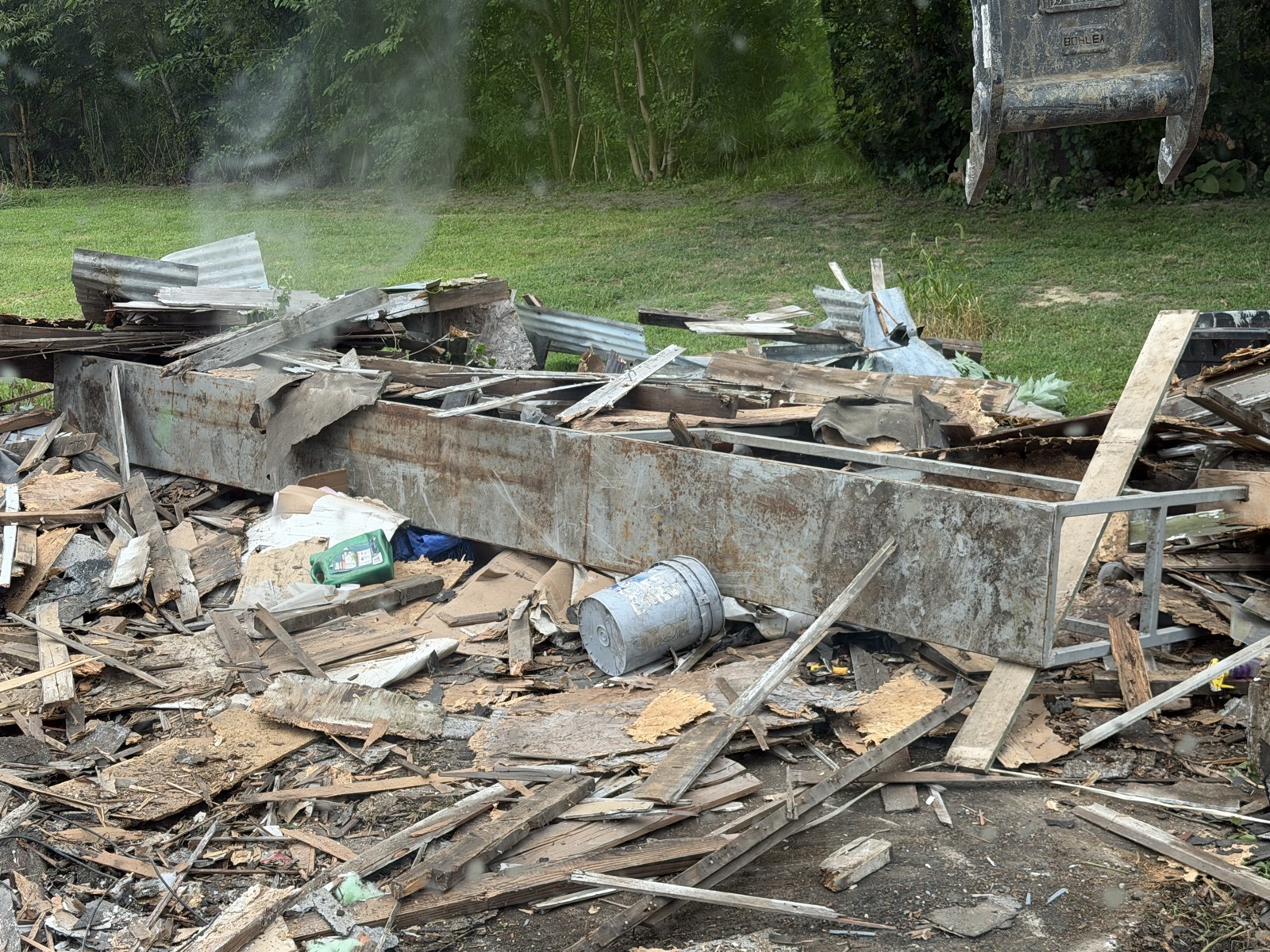 Debris pile from a garage teardown in Mattoon, IL — Brohez Trucking LLC