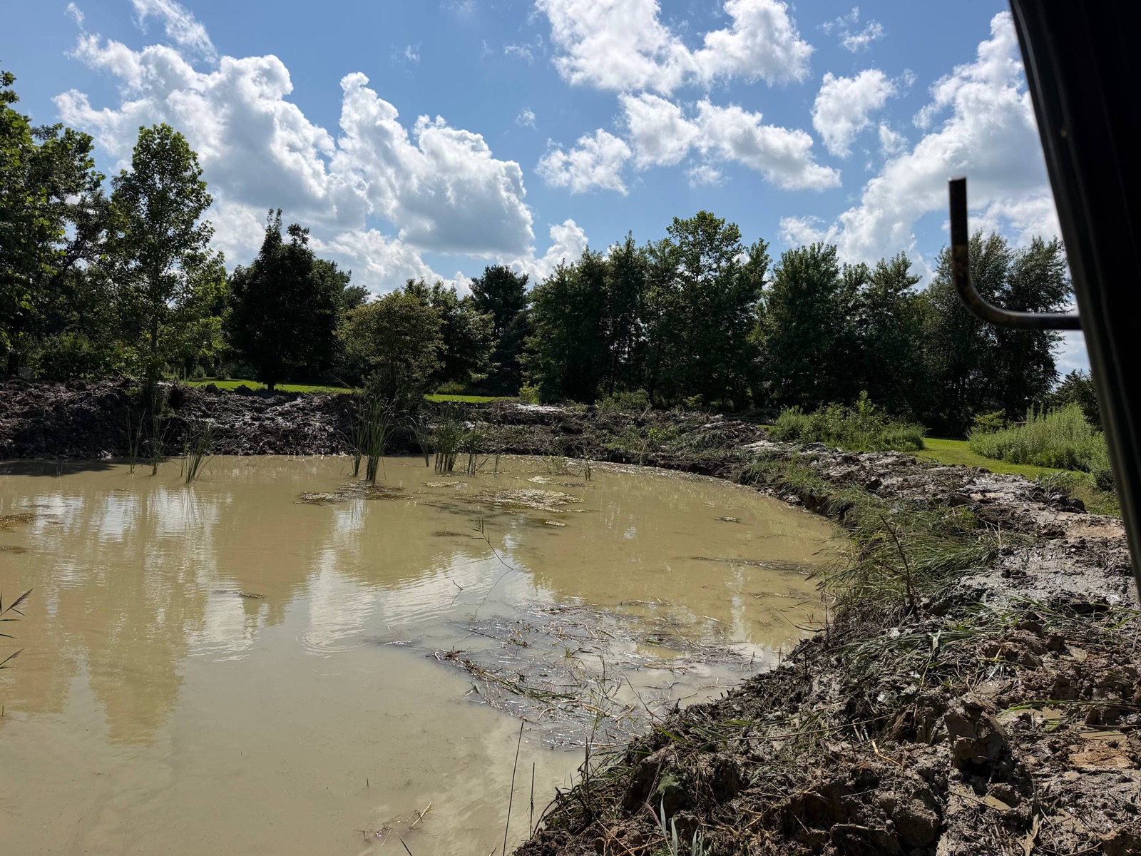 After — the reopened pond from the bank, Champaign County, Illinois — Brohez Trucking LLC