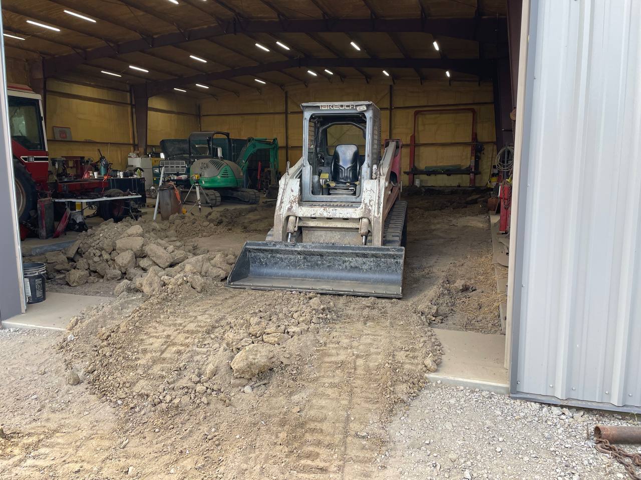 Takeuchi skid steer used for demolition cleanup — Brohez Trucking